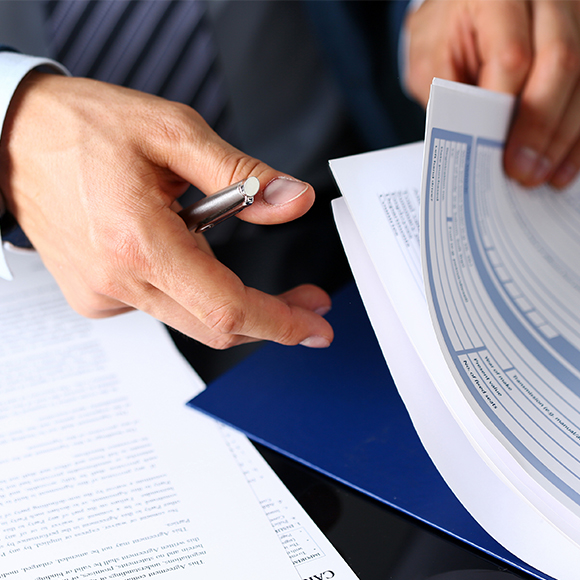 indemnity-2-product Business owner looking through documentation to promote professional indemnity insurance by Evalee Insurance Brokers