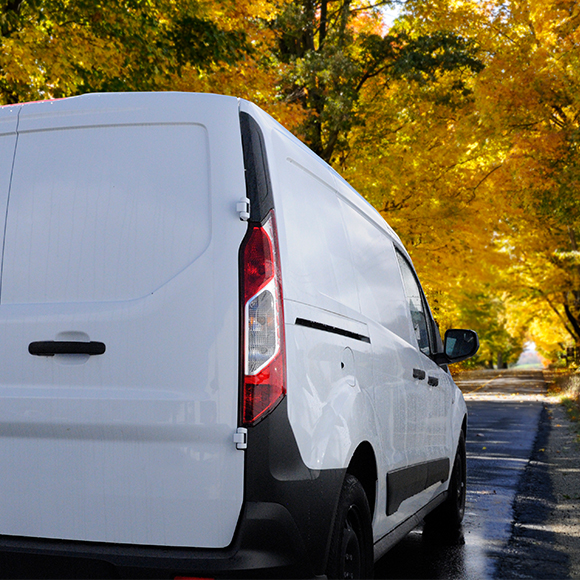 Van driving through picturesque road to promote fleet insurance by Evalee Insurance Brokers