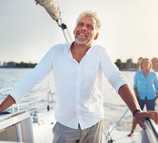 Yacht owner staring wistfully into the ocean to promote high net worth insurance by Evalee Insurance Brokers