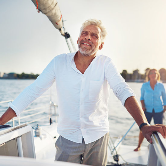 Yacht owner staring wistfully into the ocean to promote high net worth insurance by Evalee Insurance Brokers