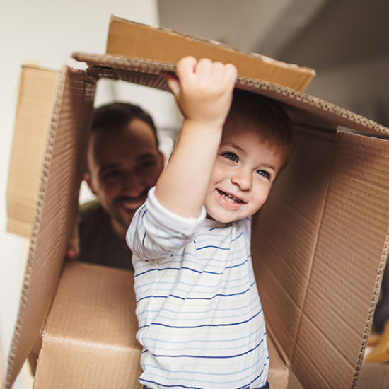 Young boy playing inside a cardboard box to promote home insurance by Evalee Insurance Brokers