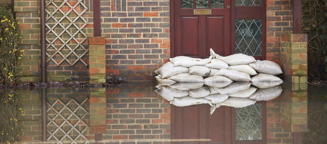 Sandbags used as a flood defence outside family home to promote flooding insurance by Evalee Insurance Brokers